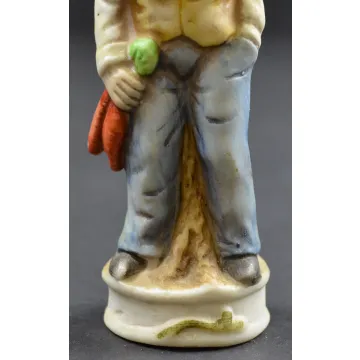 Man In Hat Leaning On A Log Ceramic Fguine - 4.75 Tall